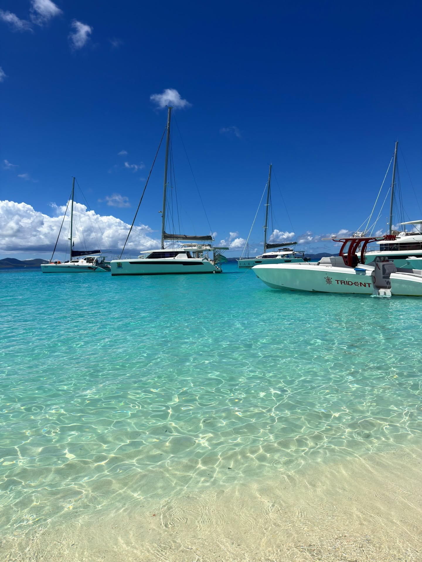 Catamarans anchored in clear shallow water off Jost Van Dyke