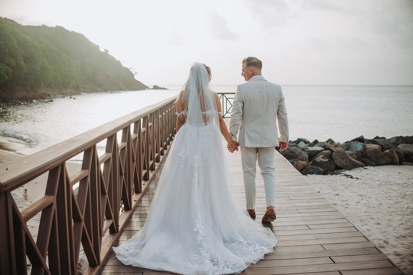 Jamie and Travis walking the boardwalk after the ceremony in St Lucia
