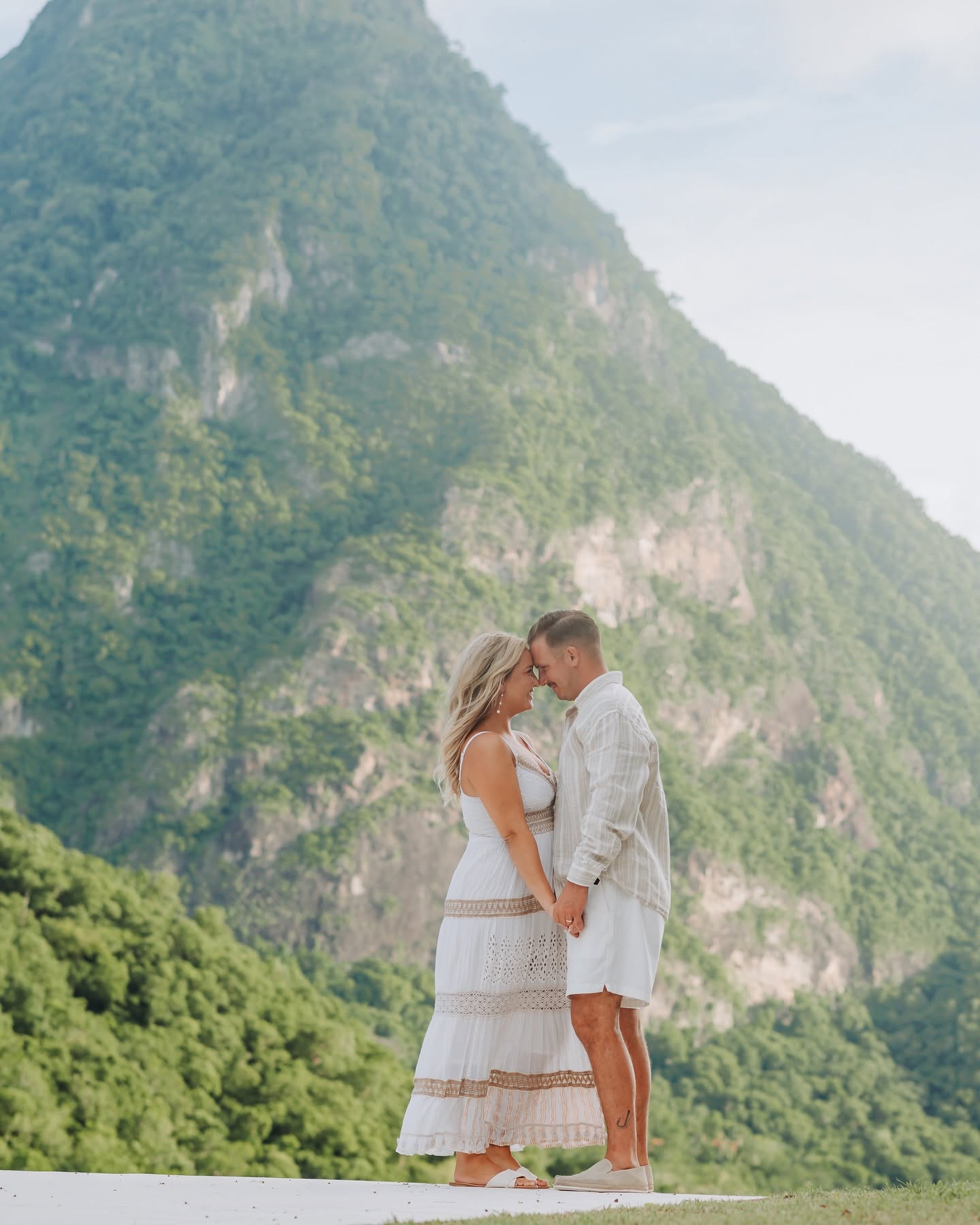 Jamie and Travis forehead to forehead beneath Petit Piton, St Lucia