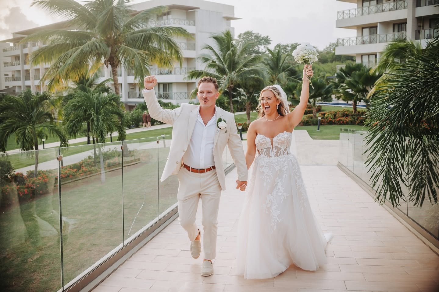 Hands in the air with the bouquet, just married in St Lucia